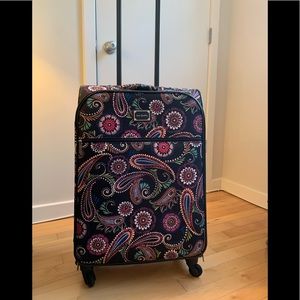 Vera Bradley Large Spinner Suitcase in vibrant black multicolor print